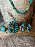 Load image into Gallery viewer, Turquoise rings on a wood block and a necklace hanging from wood block
