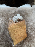 Load image into Gallery viewer, Elephant silver ring on wood block on fur background