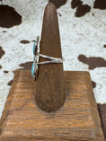 Bild in Galerie-Betrachter laden, side view of butterfly turquoise ring on brown stand with cowhide background