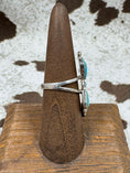 Bild in Galerie-Betrachter laden, side view of butterfly turquoise ring on brown stand with cowhide background