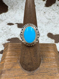 Bild in Galerie-Betrachter laden, Southwestern Moonstone Turquoise and Sterling Silver Oval Ring on a brown stand with cowhide background