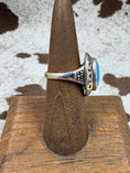 Bild in Galerie-Betrachter laden, Side view of Southwestern Moonstone Turquoise and Sterling Silver Oval Ring on a brown stand with cowhide background