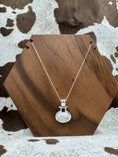 Load image into Gallery viewer, Sterling SIlver FAS White Howlite Necklace on wood block with cowhide background