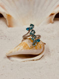 Bild in Galerie-Betrachter laden, Blue Topaz and Sterling Silver Ring on seashell in the sand with seashell in the background