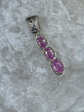 Bild in Galerie-Betrachter laden, Pink Sapphire and Sterling Silver Pendant on white rock with cowhide background