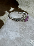 Bild in Galerie-Betrachter laden, Side view of Pink Sapphire and Sterling Silver Ring on white rock with cowhide background and 925 showing on ring
