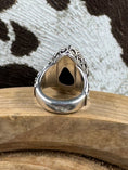 Load image into Gallery viewer, Underside of Vintage Black Onyx Ring on wood block with cowhide background