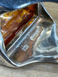 Load image into Gallery viewer, Underside of Sterling Silver Square Amber ring on wood block