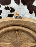 Load image into Gallery viewer, side view of Jade and Mother of Pearl Flower RIng on wood block with cowhide background