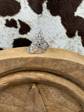 Load image into Gallery viewer, Side view Sterling Silver Ring on wood block with cowhide background