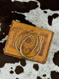 Bild in Galerie-Betrachter laden, Gold Hoop Earrings on western leather box with cowhide background