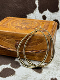 Bild in Galerie-Betrachter laden, Gold Hoop Earrings on western leather box with cowhide background