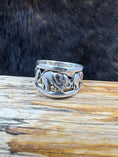 Load image into Gallery viewer, Vintage Sterling Silver Elephant with Babies Ring on wood block with dark fur background