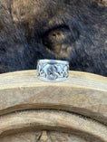 Load image into Gallery viewer, Vintage Sterling Silver Elephant with Babies Ring on wood block with dark fur background