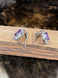Load image into Gallery viewer, Sterling Silver and Amethyst Earrings open on wood block with fur background