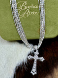 Load image into Gallery viewer, Diamond Chip and Sterling Silver Cross Pendant by Barbara Bixbie with Silver Chain on cowhide background and with green box that says Barbara Bixby