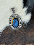 Load image into Gallery viewer, Druzy Blue Quartz and Sterling Silver Pendant on cowhide background