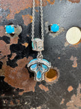 Load image into Gallery viewer, back of Vintage Sterling Silver and Turquoise Necklace and Earrings on black stand with cowhide background