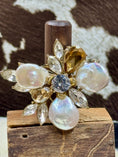 Load image into Gallery viewer, Faux Pearl and Crystal Flower Ring on wood block with cowhide background