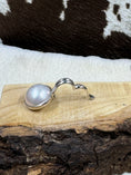 Load image into Gallery viewer, Faux Pearl and Sterling Silver Necklace Enhancer open on wood board with cowhide background