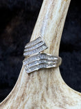 Load image into Gallery viewer, Goregous Genuine Diamond Swirl Ring on moose antler with fur background