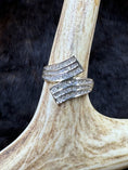 Load image into Gallery viewer, Goregous Genuine Diamond Swirl Ring on moose antler with fur background