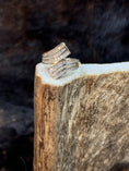 Load image into Gallery viewer, Goregous Genuine Diamond Swirl Ring on moose antler with fur background
