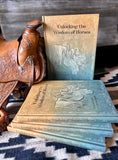 Bild in Galerie-Betrachter laden, Book and a saddle with wood background laying on blue and white blanket
