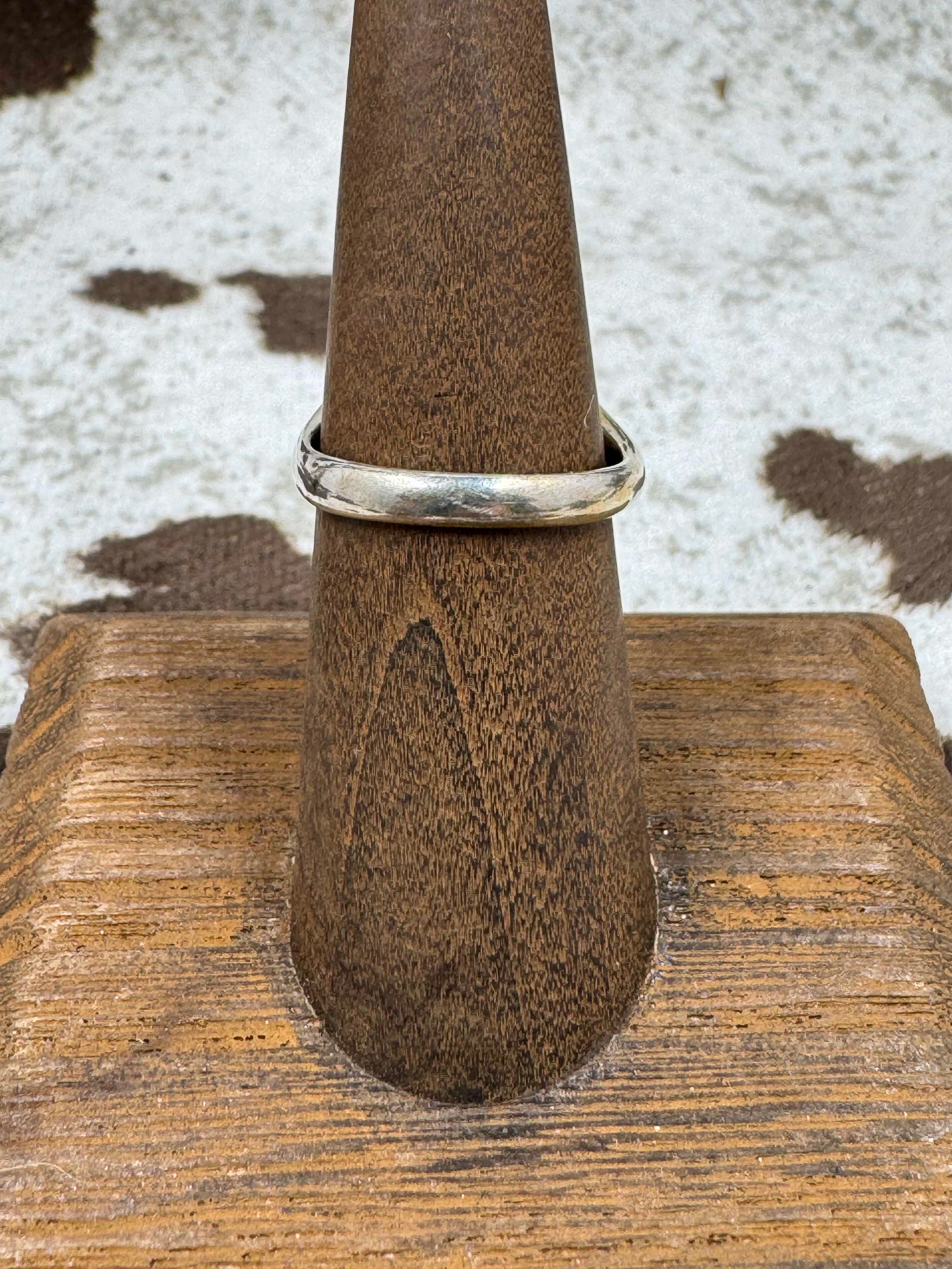 Back view of Southwestern Moonstone Turquoise and Sterling Silver Oval Ring on a brown stand with cowhide background