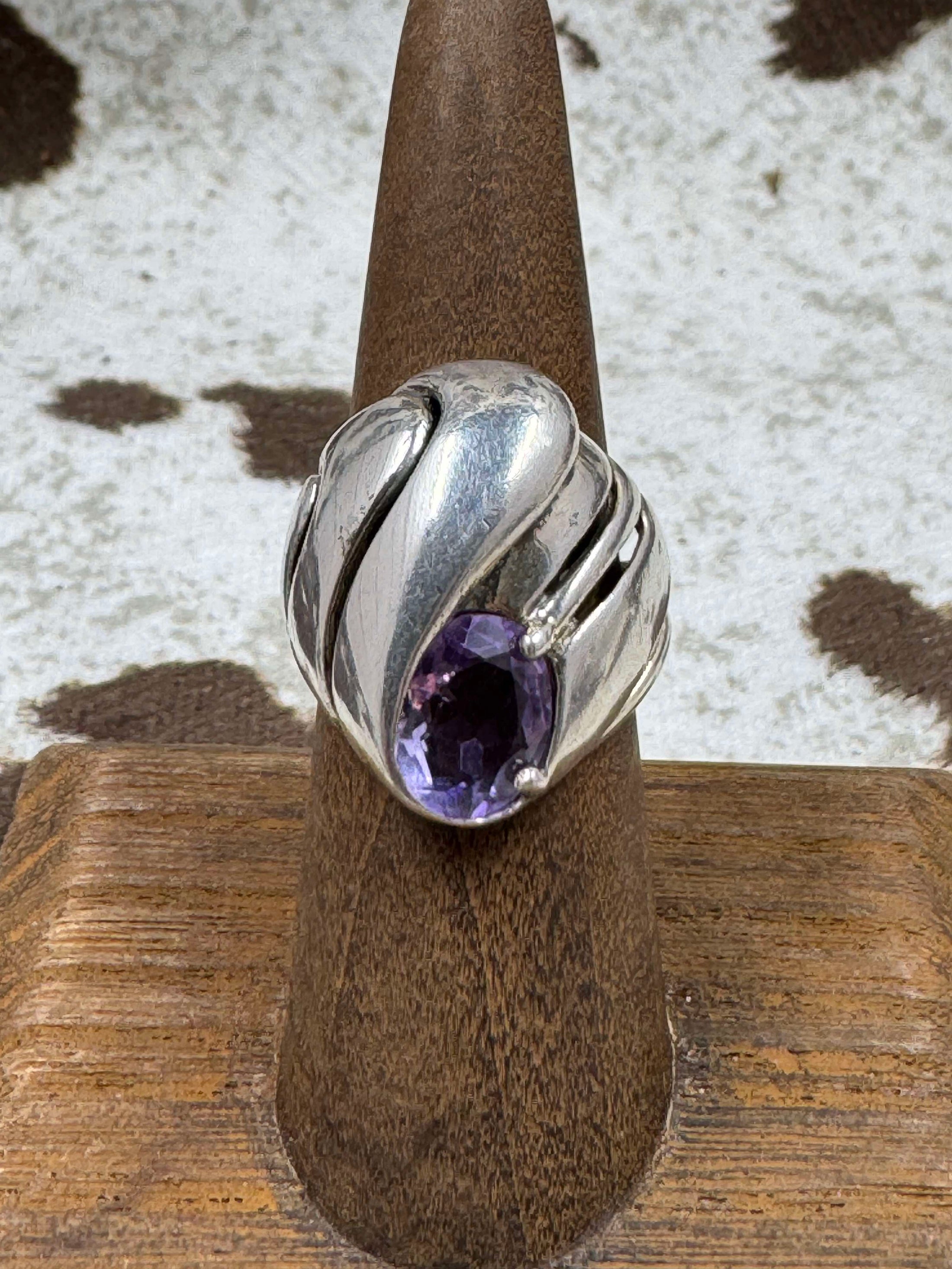 Vintage Kabana Amethyst Dome Ring on brown stand with cowhide background