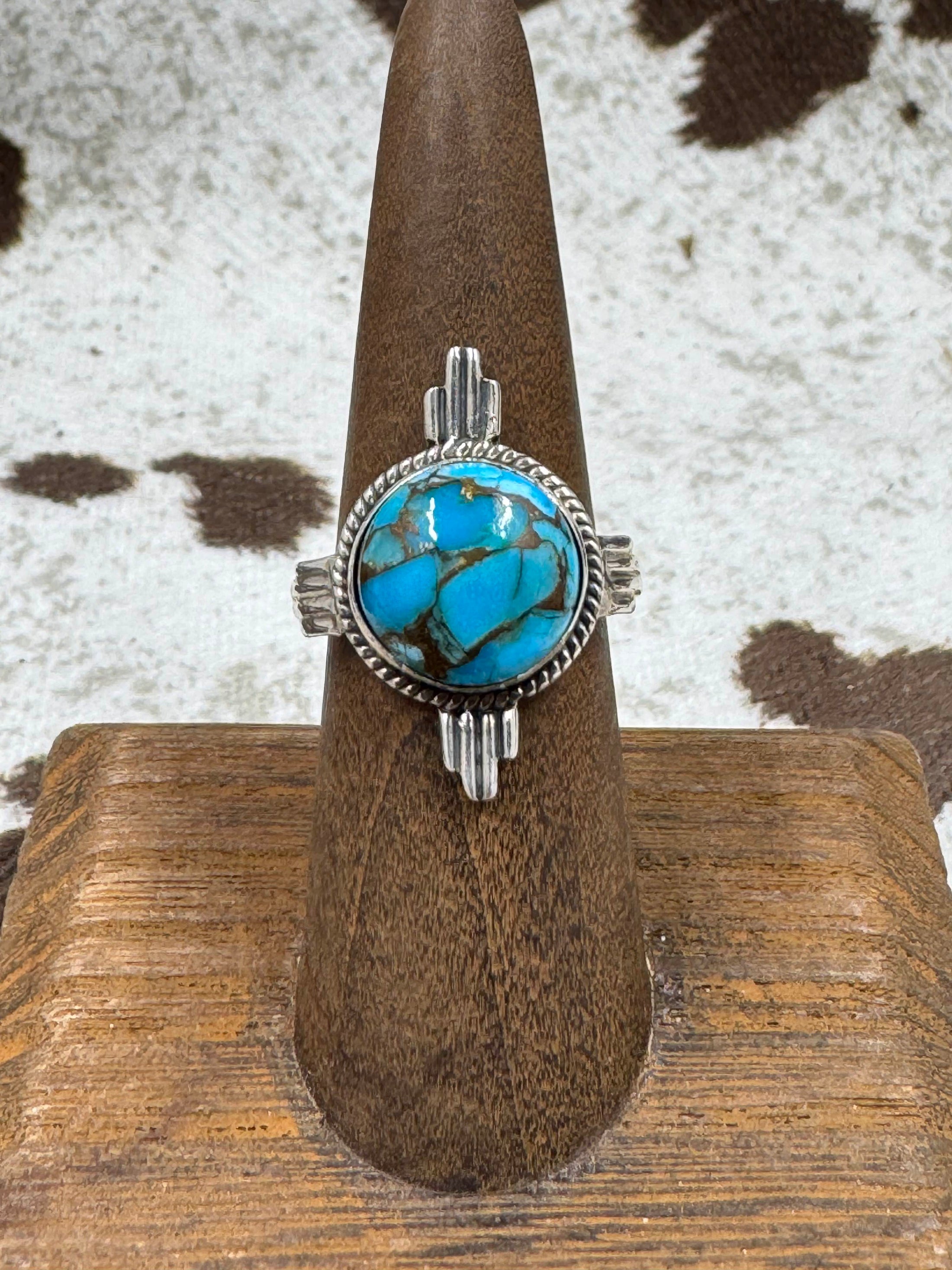 Turquoise ring on a stand