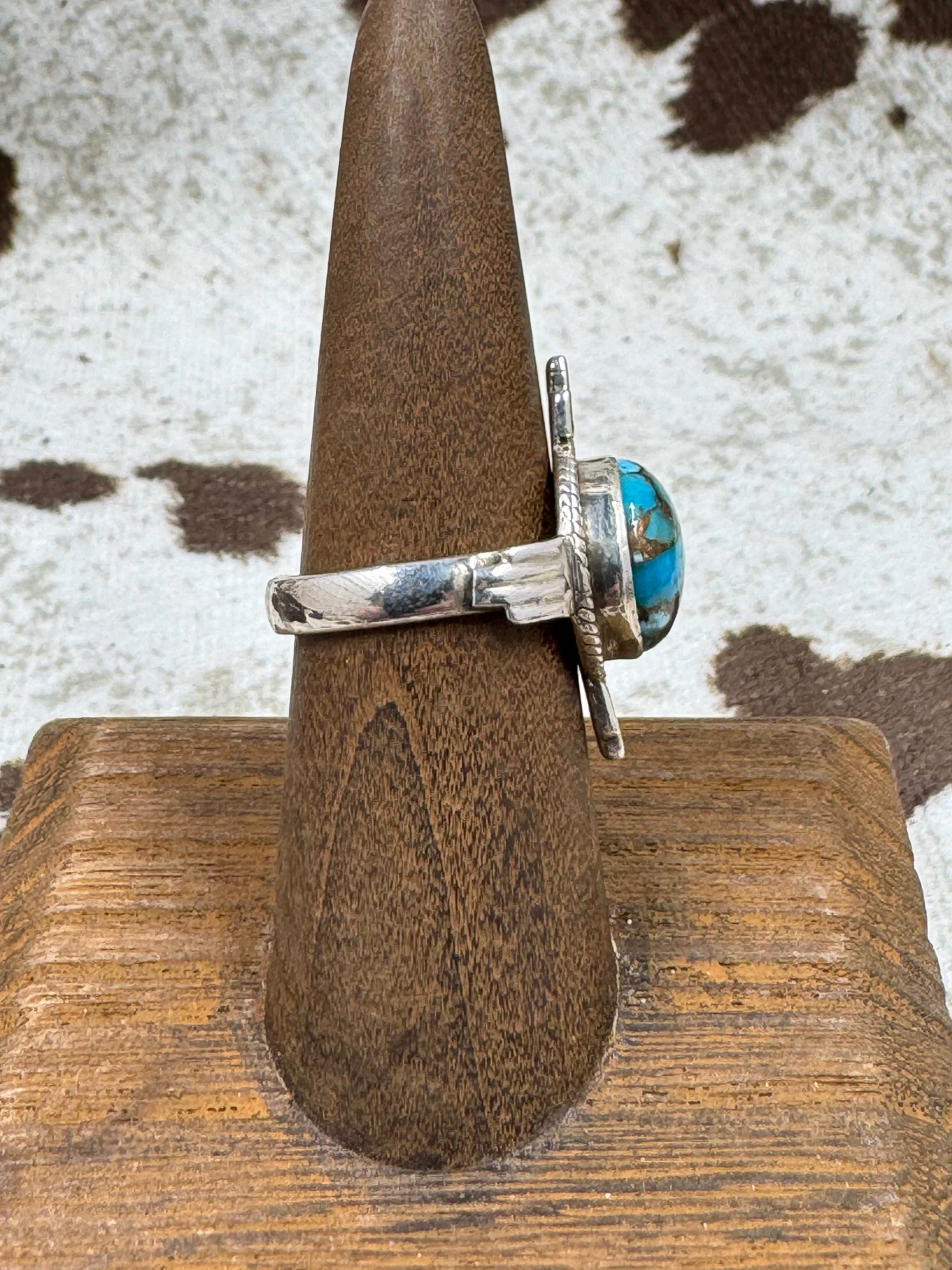 Side view Turquoise ring on a stand