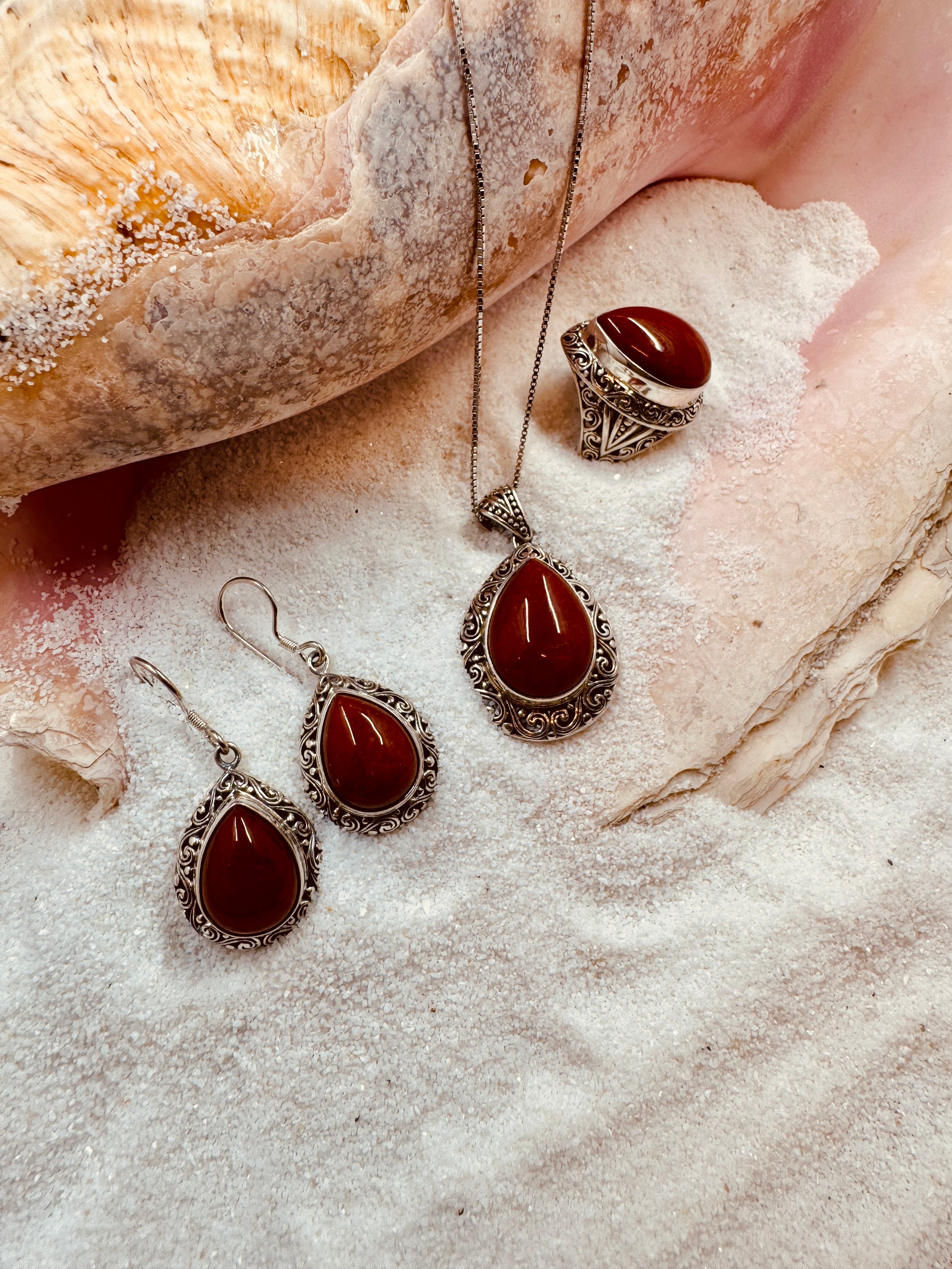 Carnelian Earrings, Ring and Necklace Set on sand with sea shell