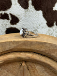 Load image into Gallery viewer, side view of Australian White Opal Halo Sapphire Ring on wood block with cowhide background
