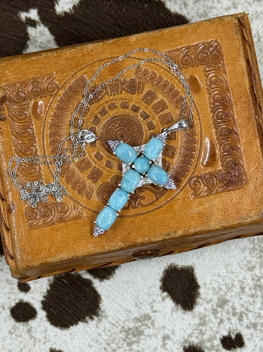 Larimar Cross with Sterling SIlver Chain on leather box with cowhide background