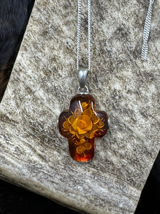 Floral Bouquet Amber Cross Set in Sterling Silver laying on moose antler piece