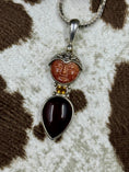 Load image into Gallery viewer, Sajen Goldstone and Citrine Pendant on cowhide background
