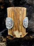 Load image into Gallery viewer, Back side of Elephant Bracelet Cuff wrapped around wood block with fur background
