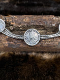 Bild in Galerie-Betrachter laden, Chain Bracelet with Coins of George V on wood block with dark fur background
