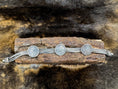 Bild in Galerie-Betrachter laden, Chain Bracelet with Coins of George V on wood block with dark fur background
