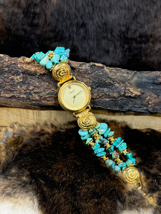 Vintage Angie Dickinson Turquoise Watch on wood block on dark fur background