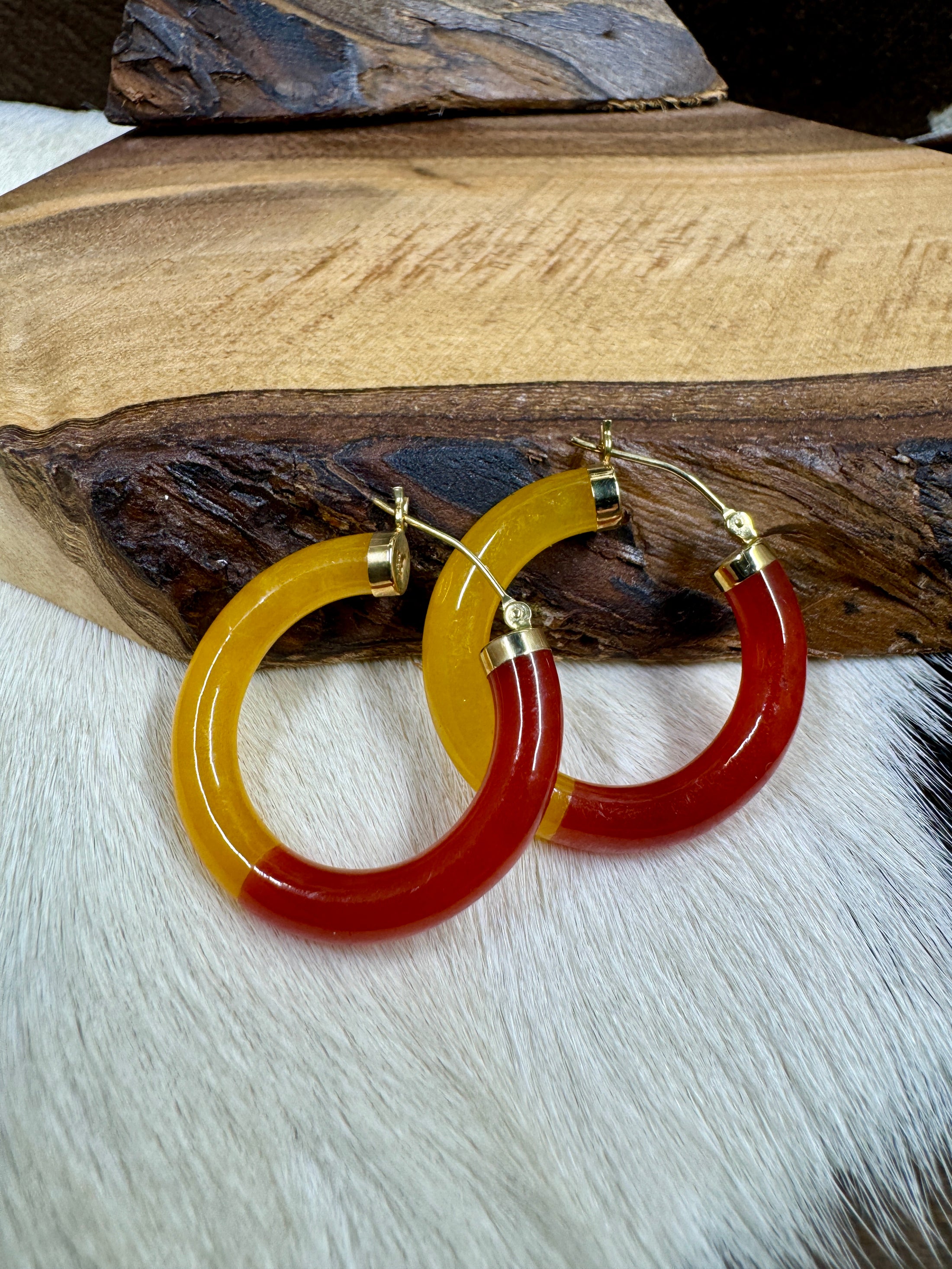 14K Yellow Gold and Bi-Color Jade Hoop Earrings on wood block and cowhide