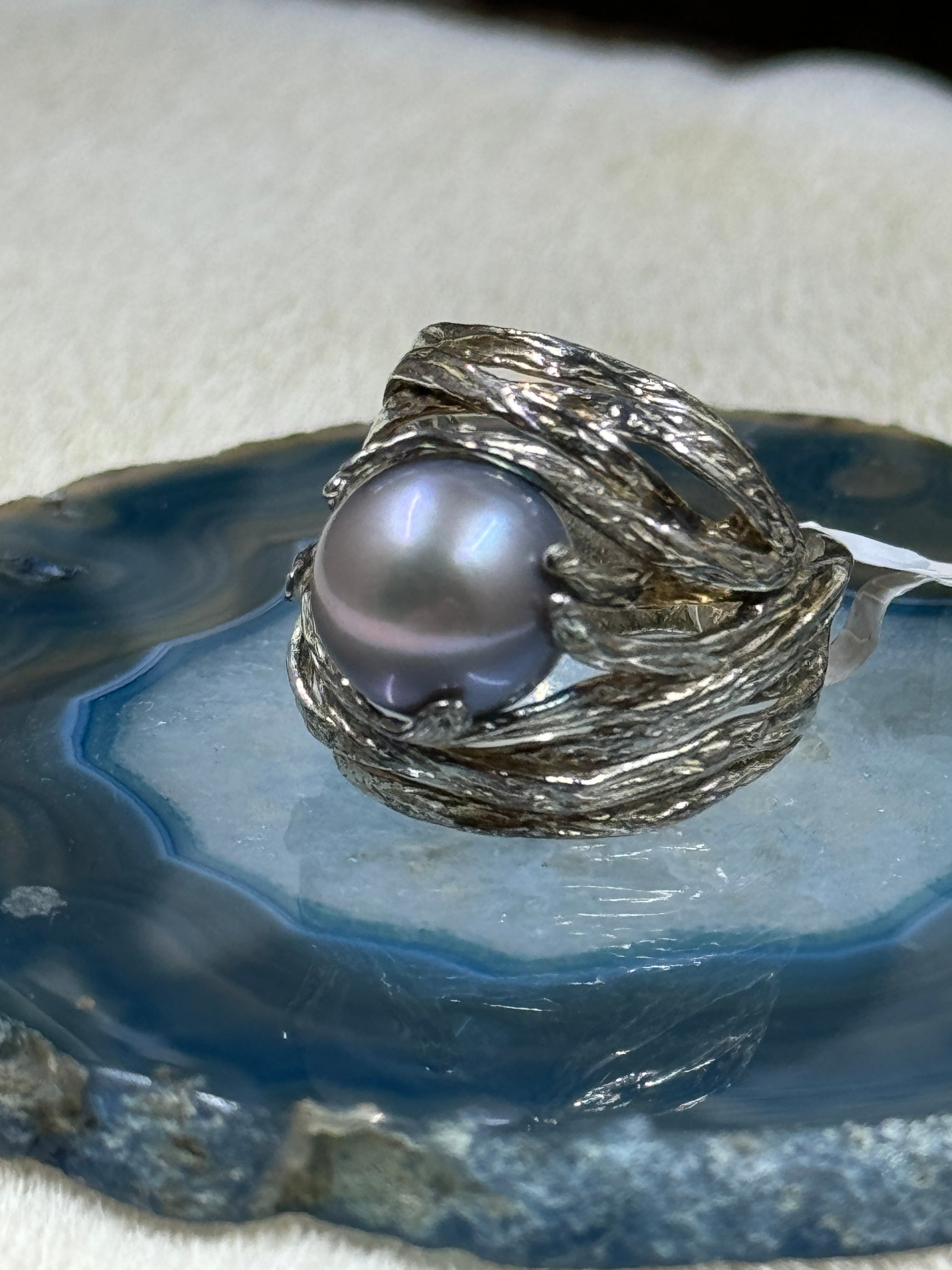 Sterling Silver and Cultured Freshwater Pearl Ring on blue quartz rock with white background