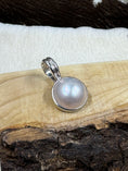 Load image into Gallery viewer, Faux Pearl and Sterling Silver Necklace Enhancer on wood board and cowhide background
