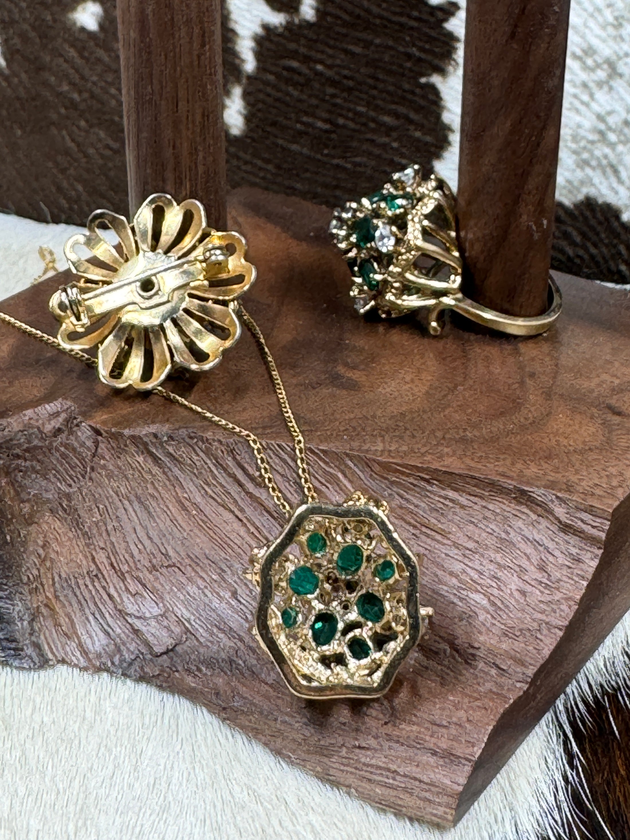 Back and Side View of Vintage Ring, Pin and Necklace Set on wood block with cowhide background