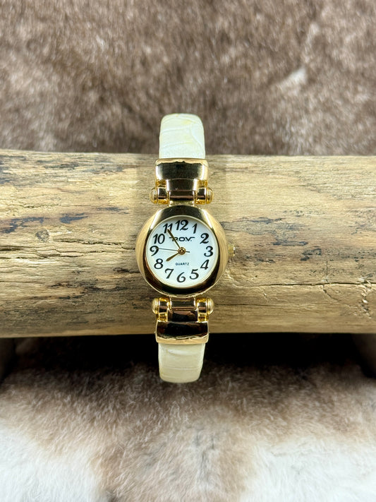 pov quartz watch on log and fur background