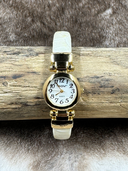 pov quartz watch on log and fur background