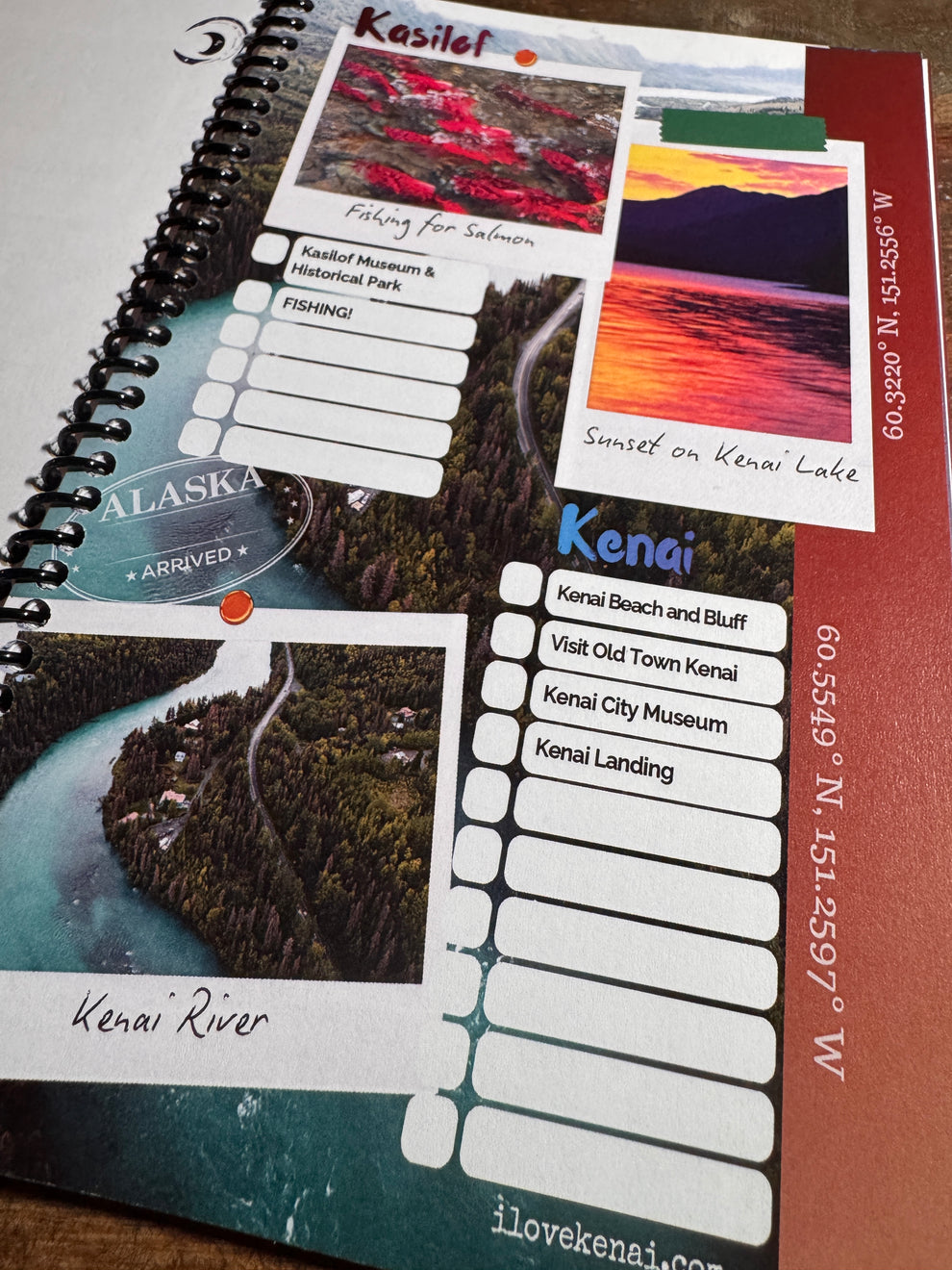 A spiral-bound Alaska travel notebook or planner page featuring scenic photos of Kenai Lake, the Kenai River, and a sunset, with text fields and address details printed on the page.