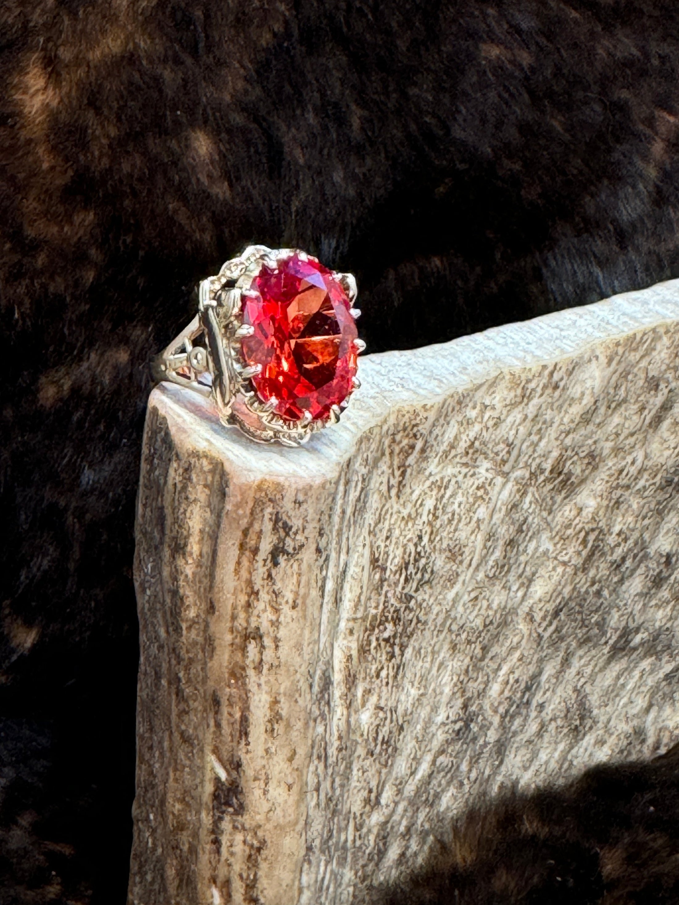 Egyptian Revival Vintage 10K Gold and Orange Sapphire Ring on moose antler with fur background