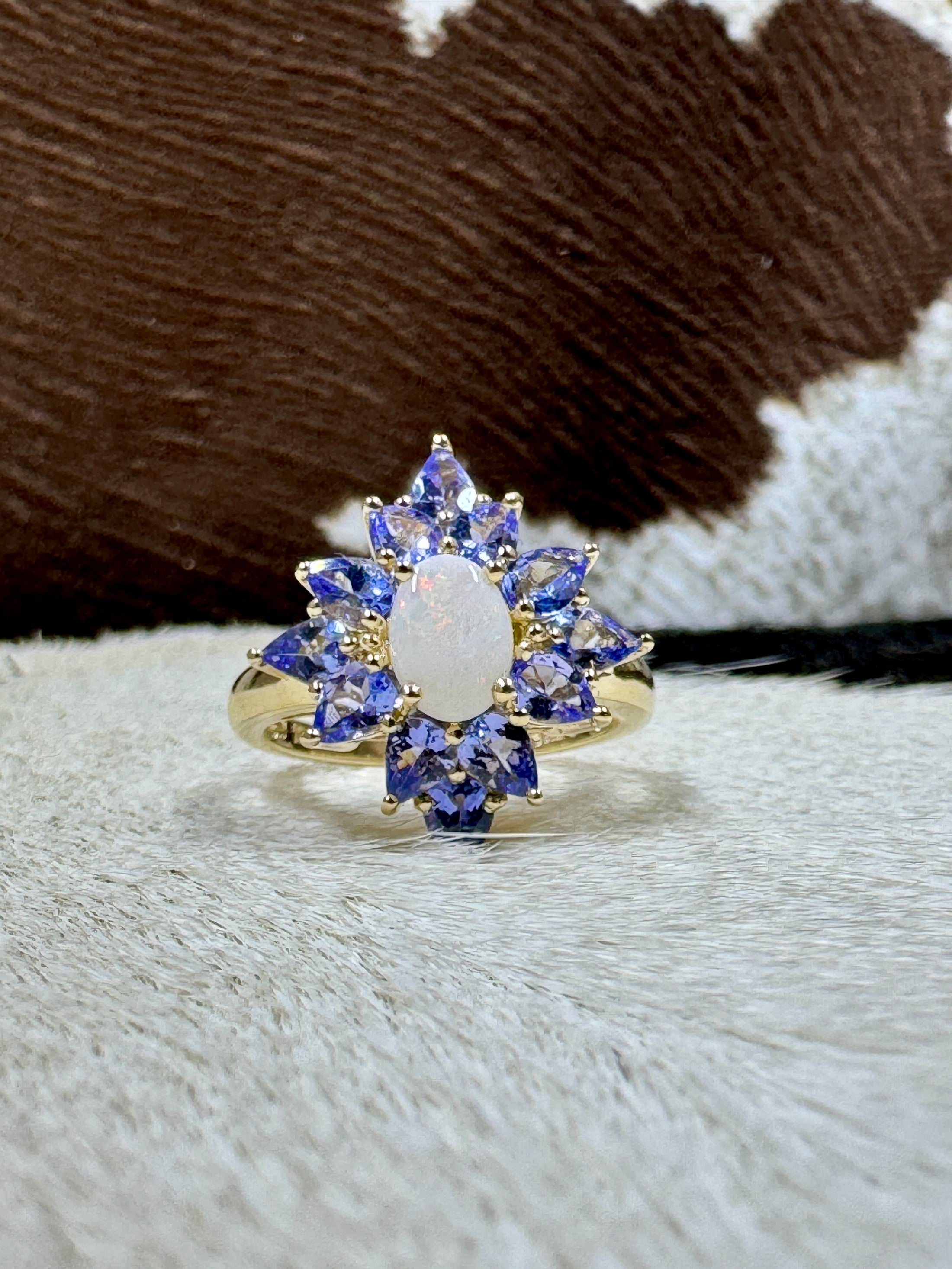 Tanzanite and Opal 10K Gold Ring on cowhide